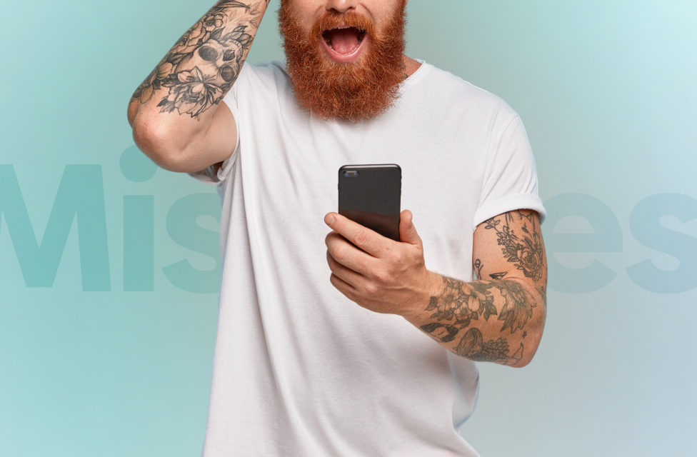 A guy in a white shirt holding his arm on the head with a mobile phone in another one