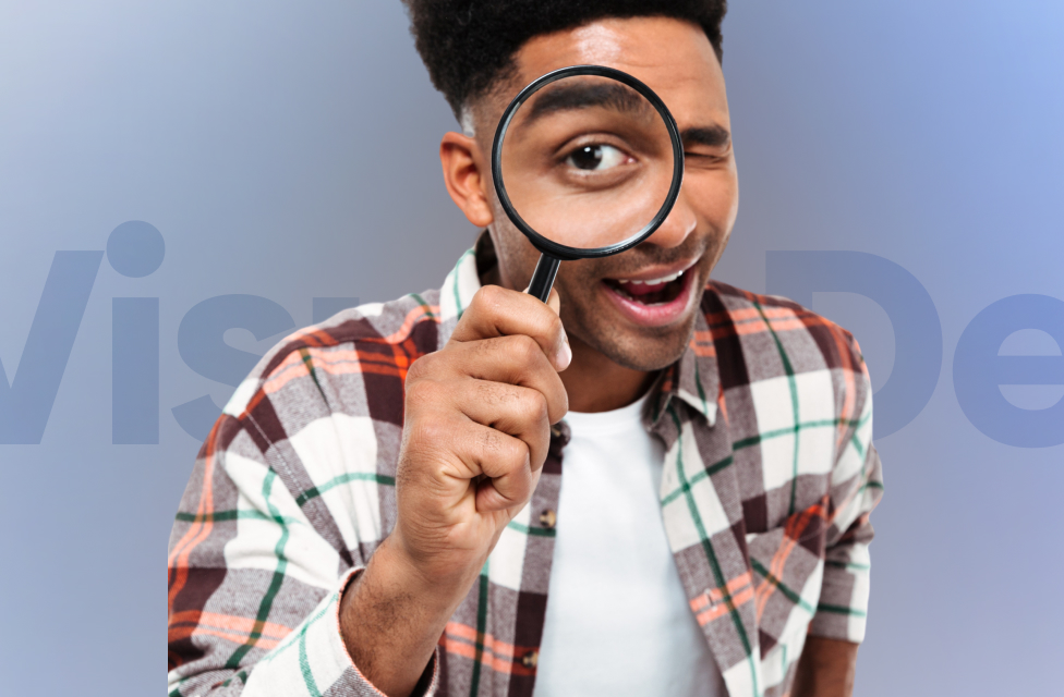 A person holding a magnifying glass