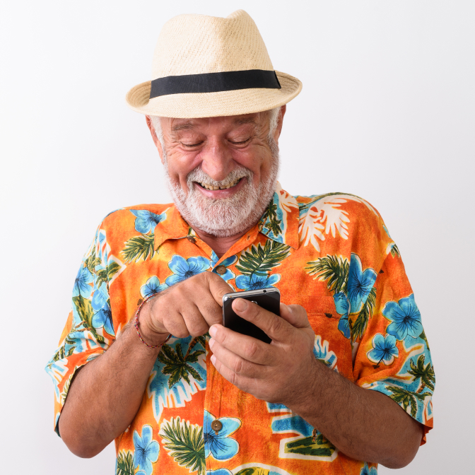 Old man in Hawaiian shirt holding a phone