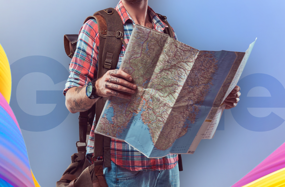 A person with travel bags holding a map